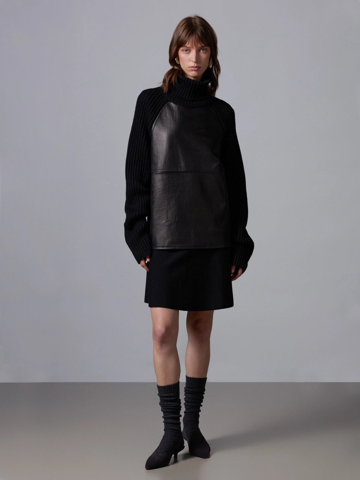 Collo alto con pelle